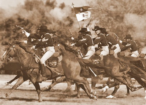 Cavalry charge carrying the Bravo Company, 2nd Battalion, 8th Cavalry guidon